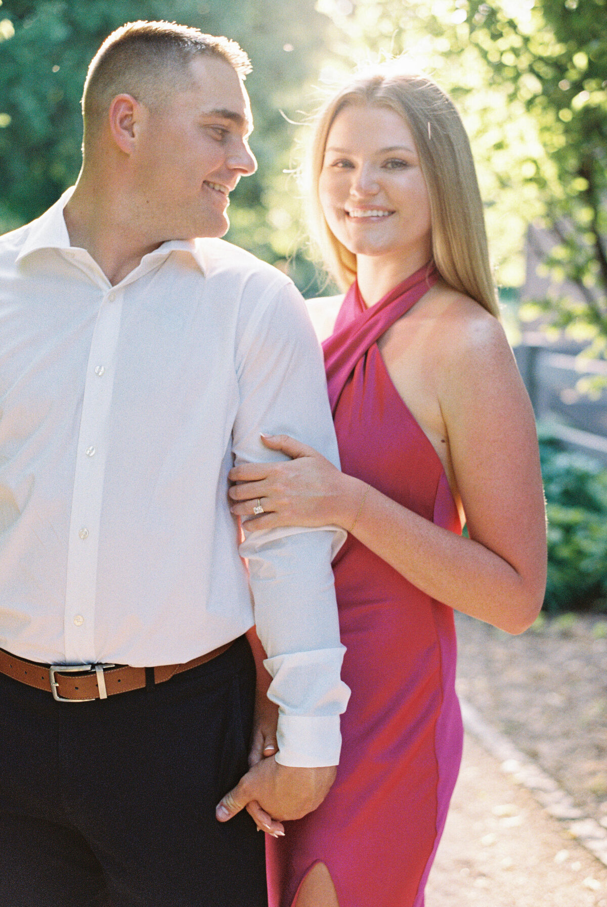 Man looks back at fiancé in Columbus park shot by Philly-based photographer.