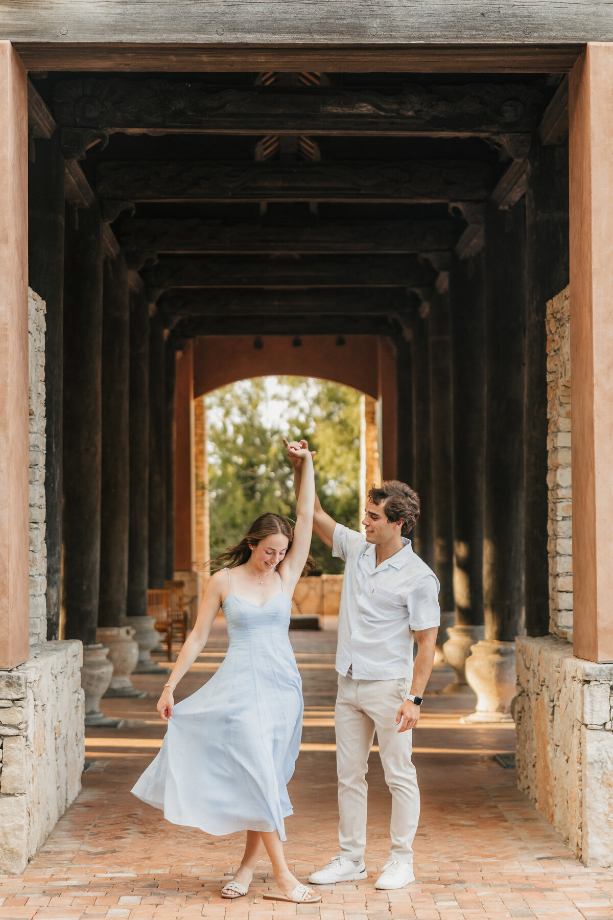 groom-twirls-bride-camp-lucy