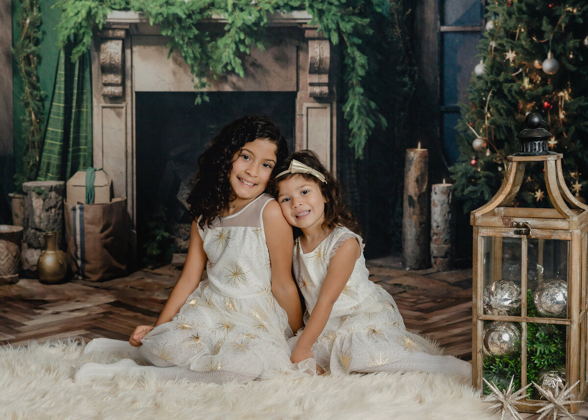 Holiday portrait of happy siblings at Allison Reilly's Union County, NJ photo studio.