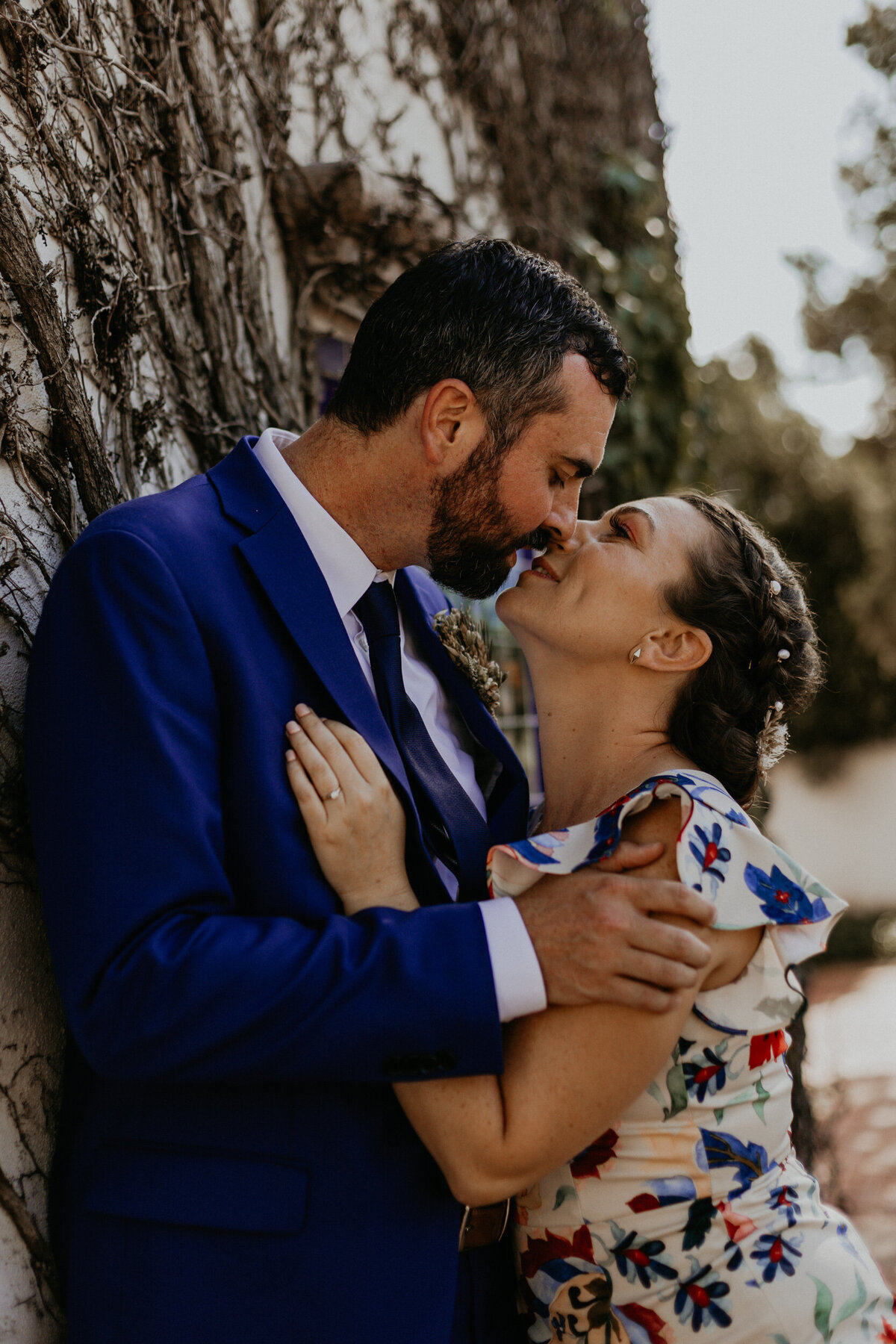 bride and groom about to kiss