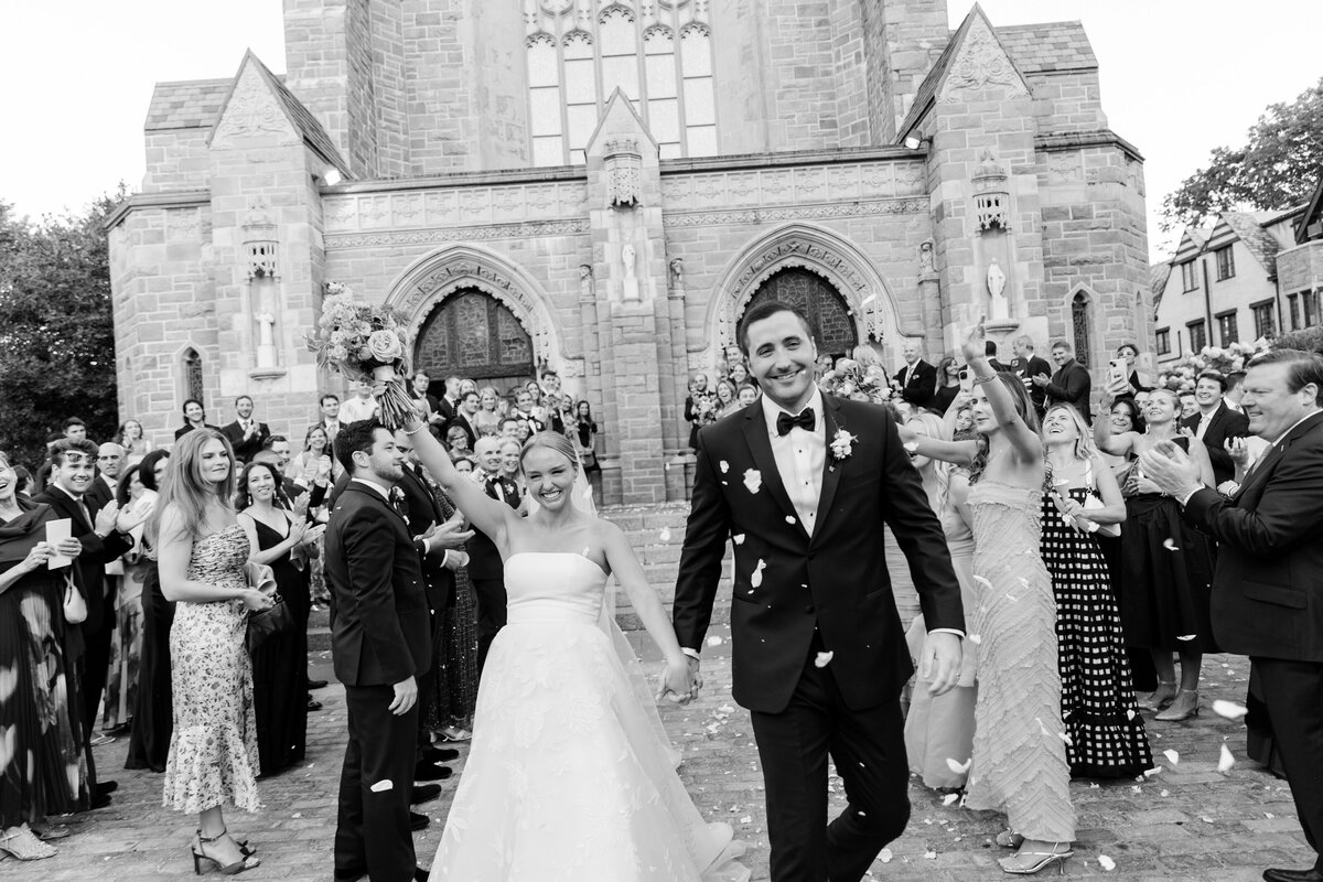 black and white groom and bride grand exit at church