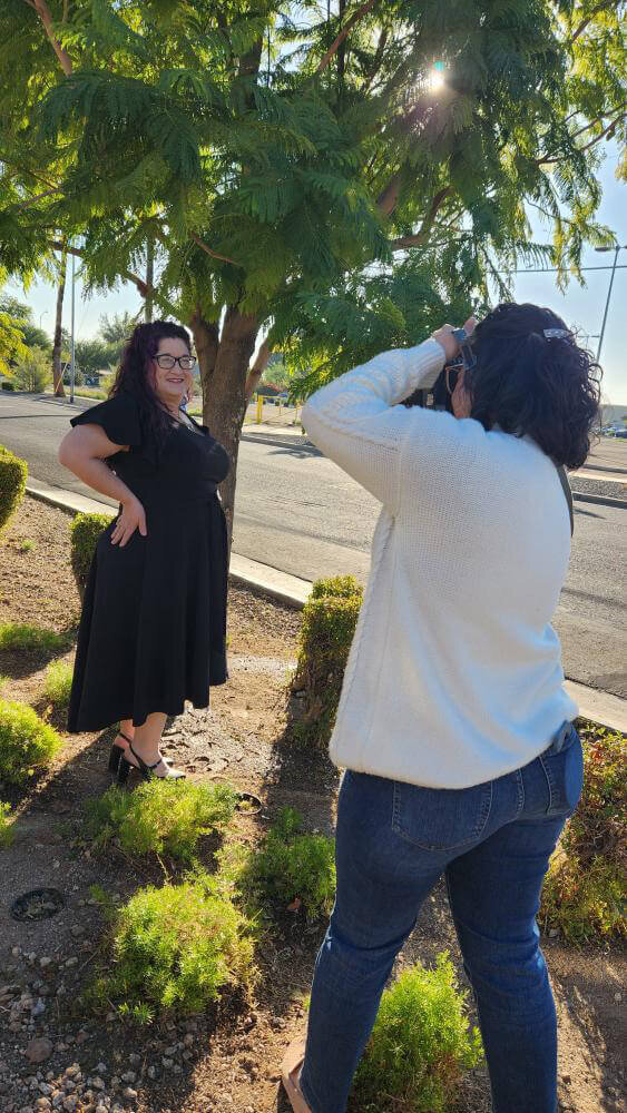 Behind the scenes photo of owner, Amber, taking a portrait of client for Arizona session