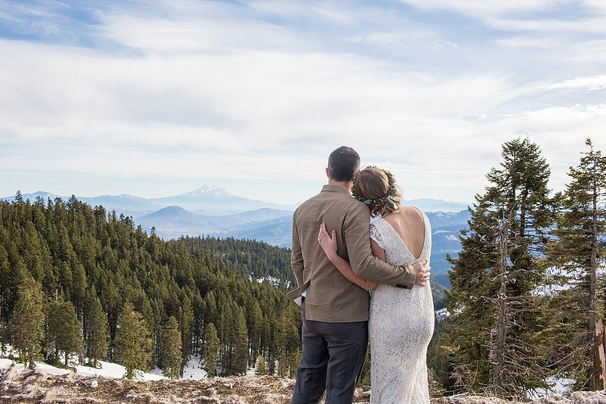 couple hugging on Mt Ashland on elopement day