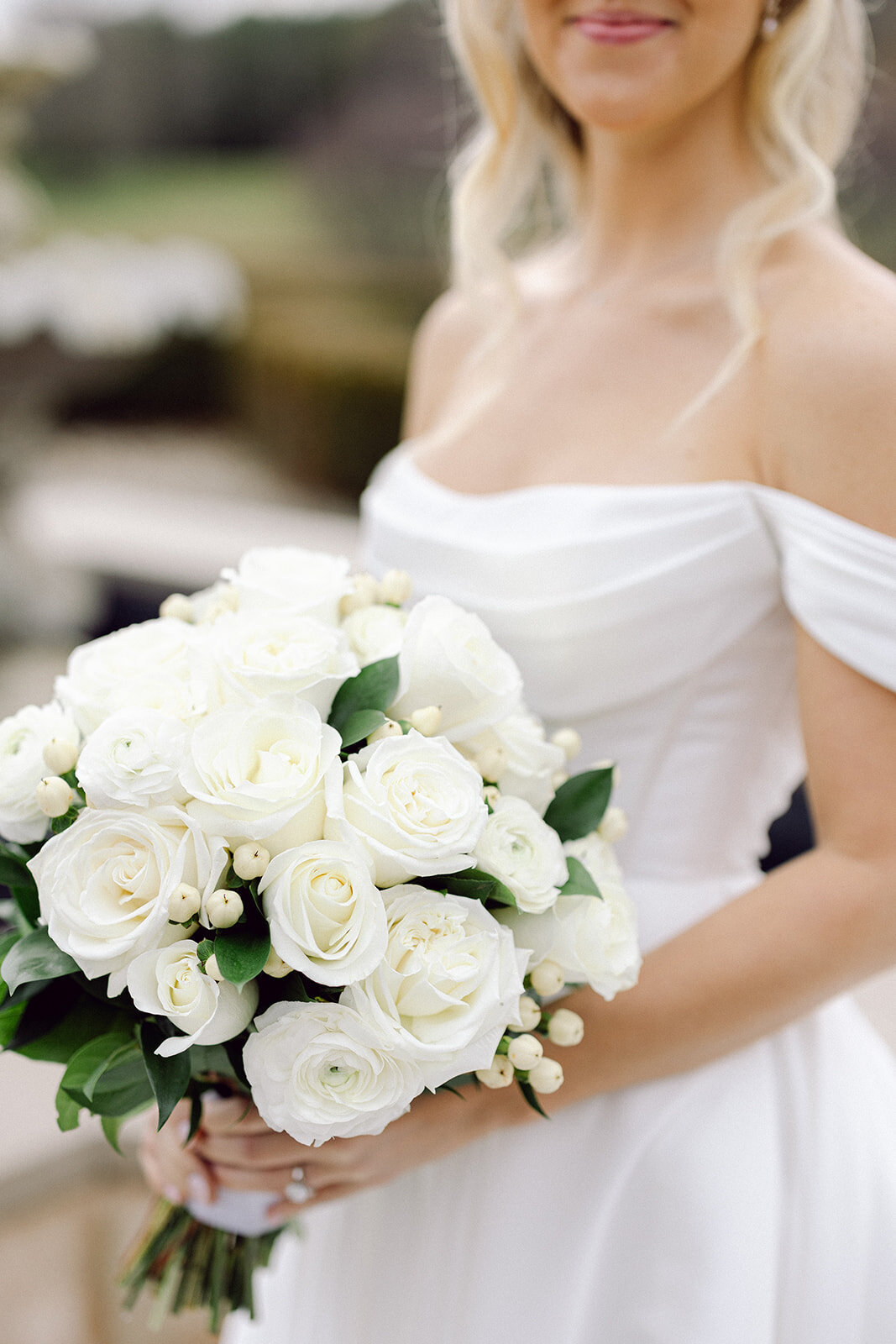 Bride up close flower shot beside a fountain at a beautiful Columbus wedding venue shot by a philly wedding photographer