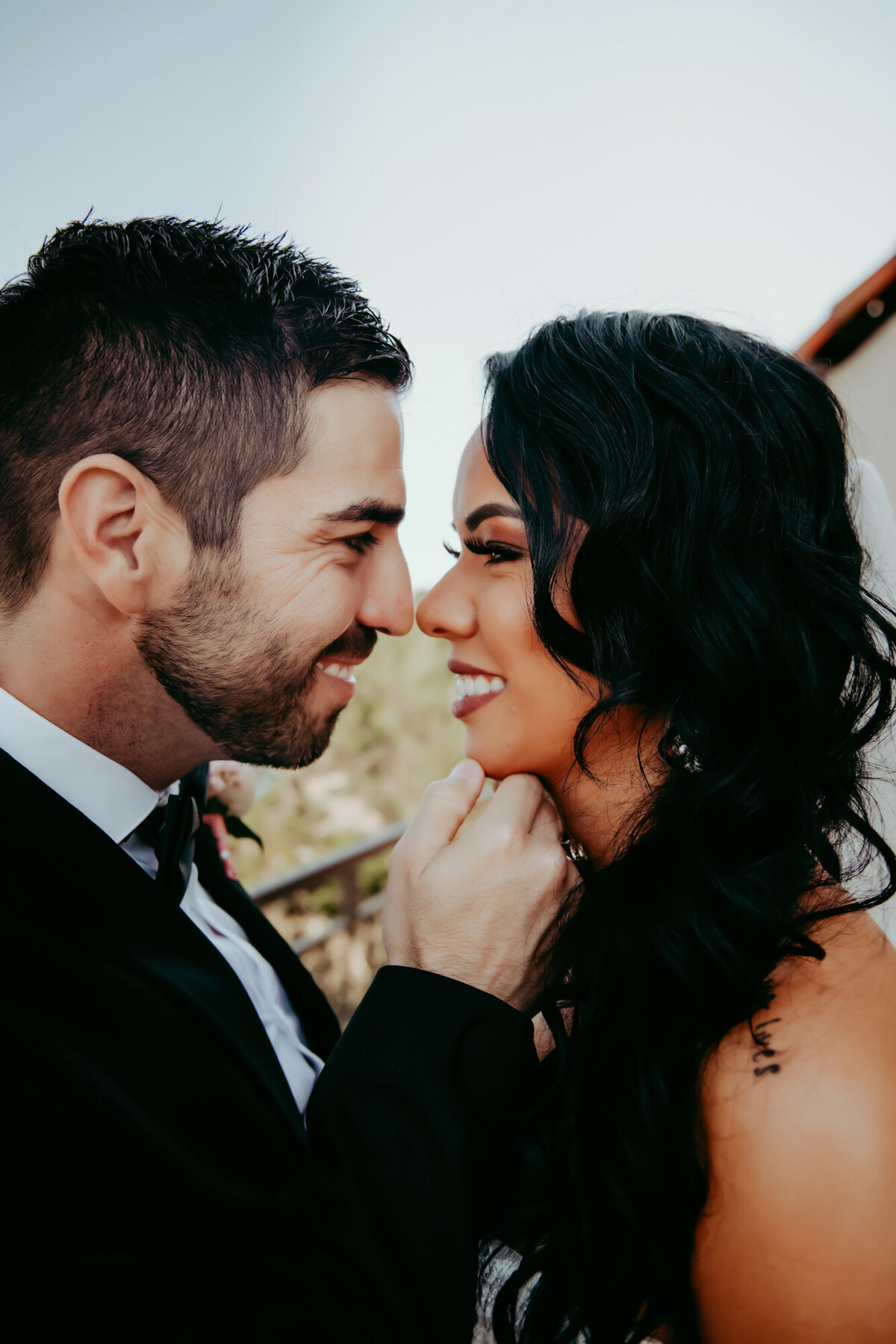 Couples Photography, bride and groom smile at each other face to face