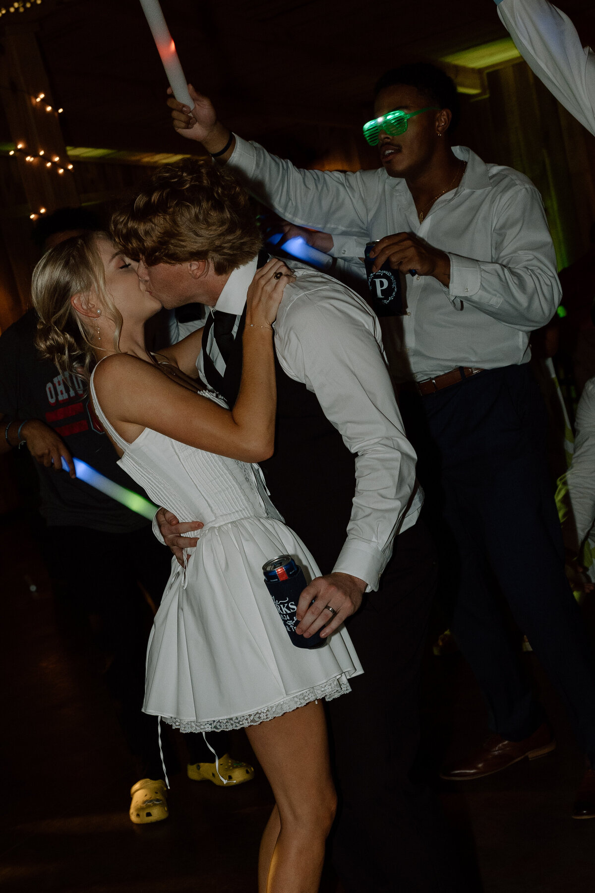 Bride and groom dance and kiss each other