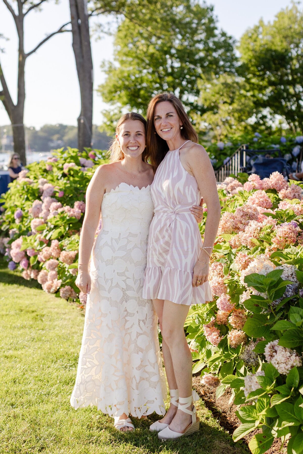 bride and guest smiling during welcome drink