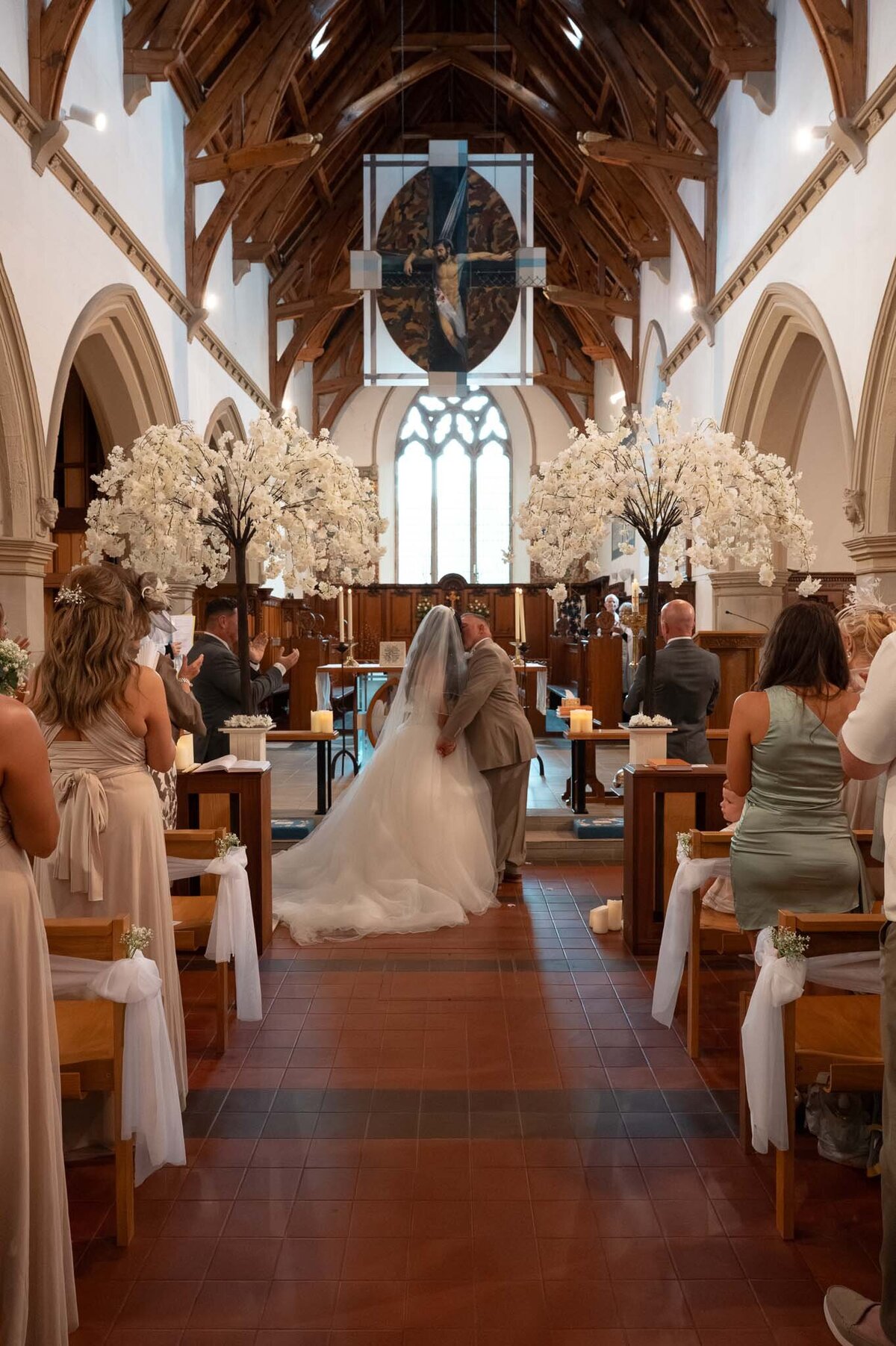 Bride and groom first kiss during Wedding Church Ceremony - Manchester Wedding Photography