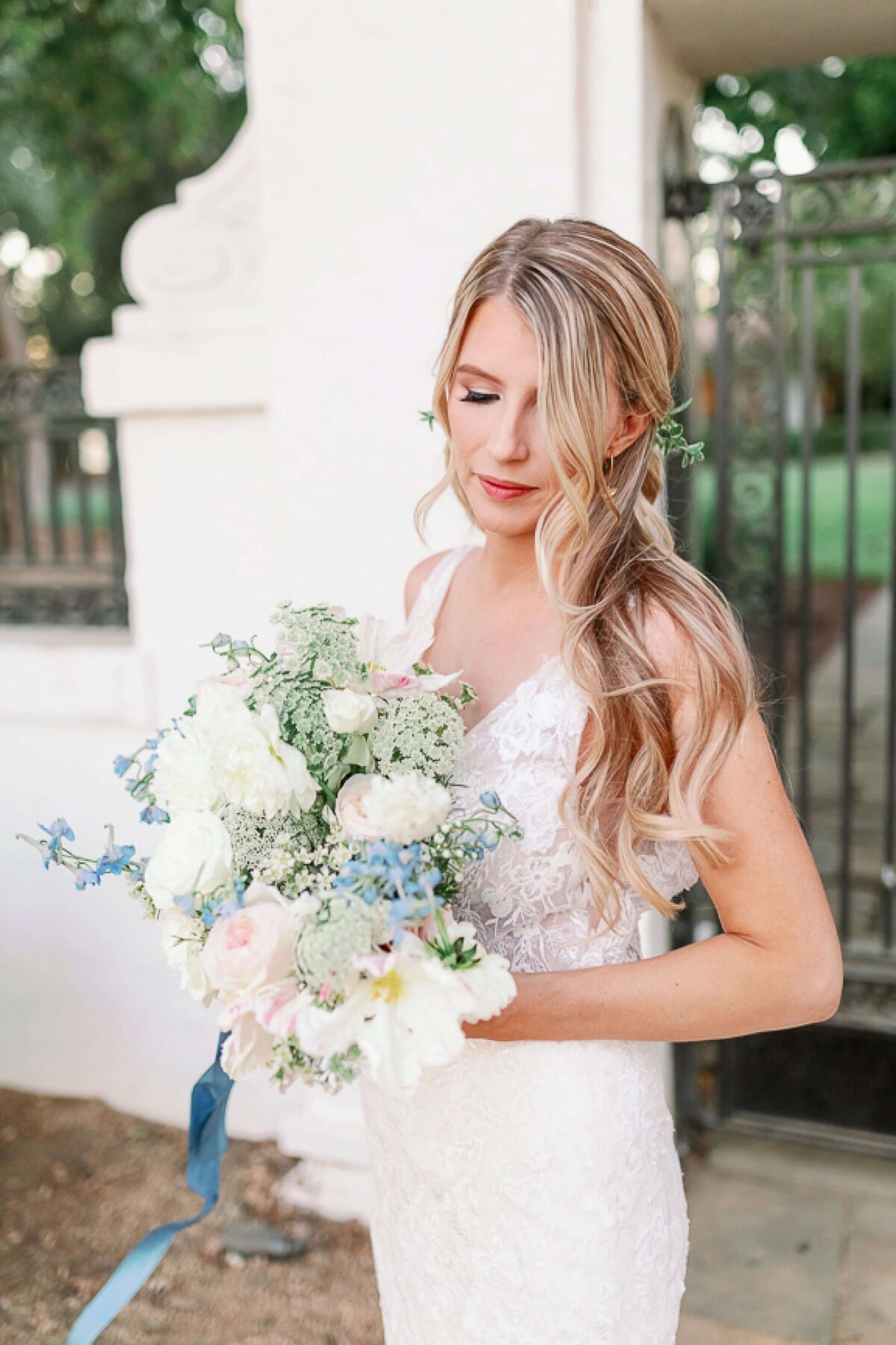 bride with blue bouquet
