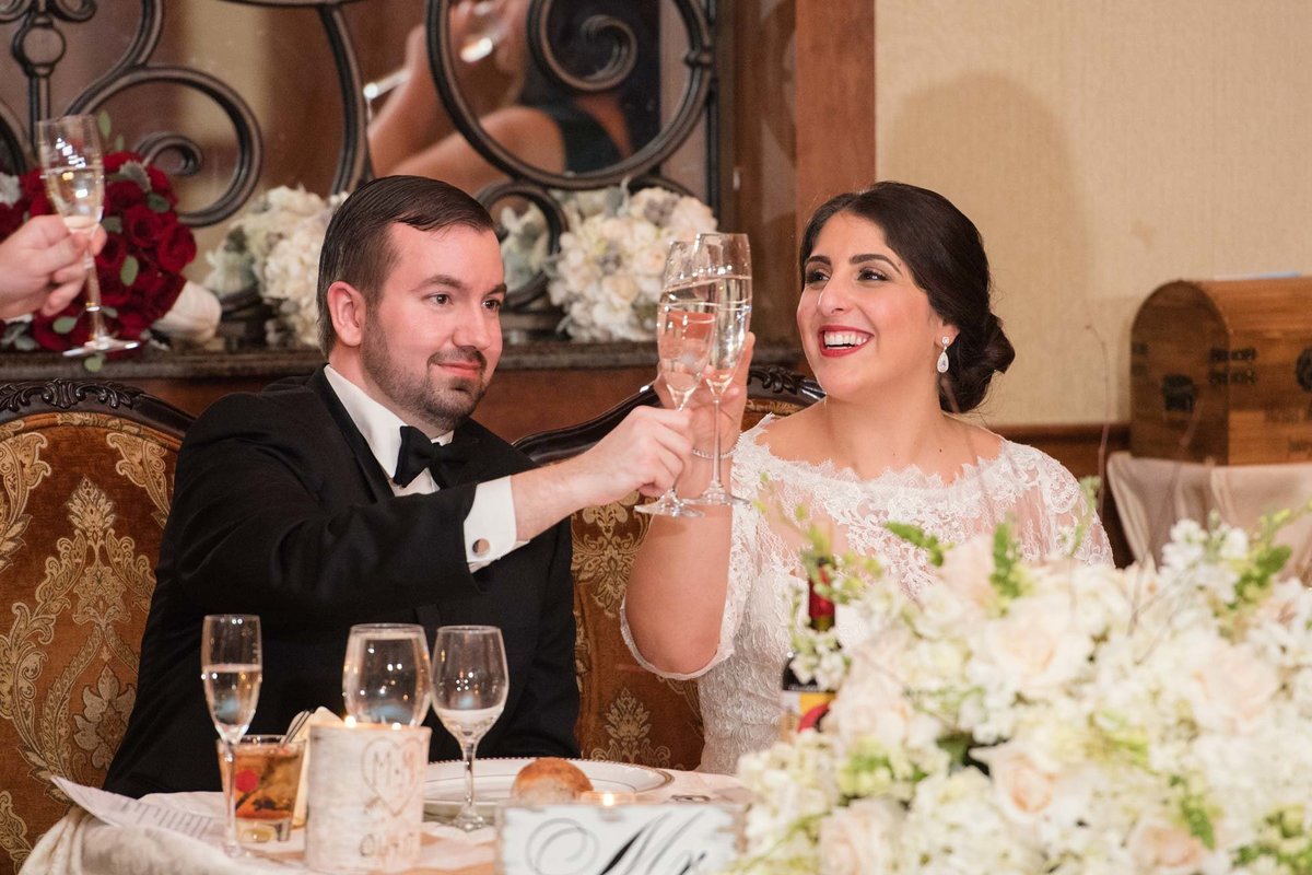 Bride and groom toasting at Larkfield Manor