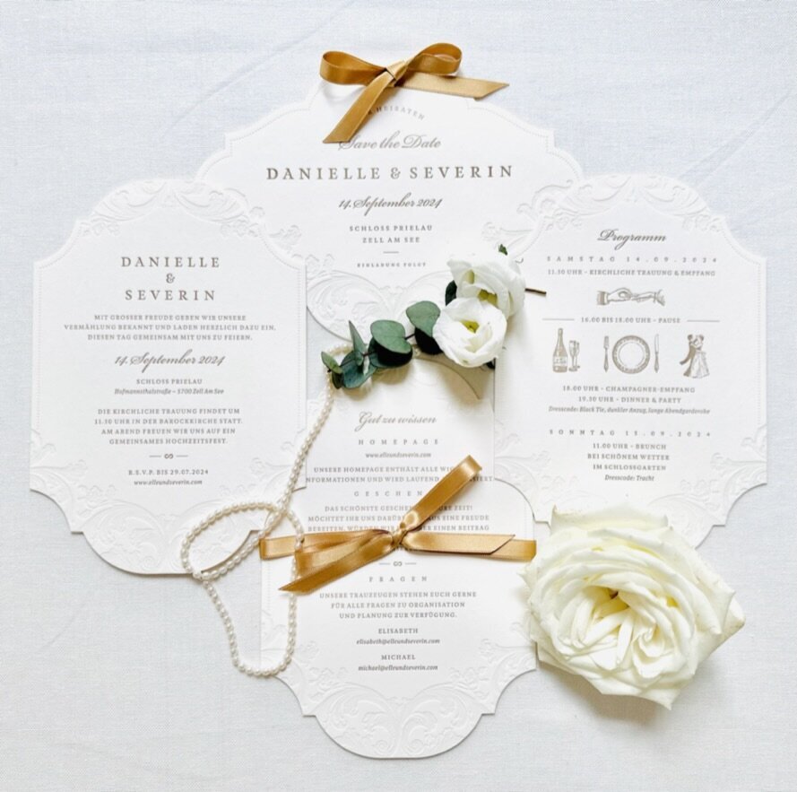 Luxury bespoke wedding stationery in white and gold for a destination wedding in Austria