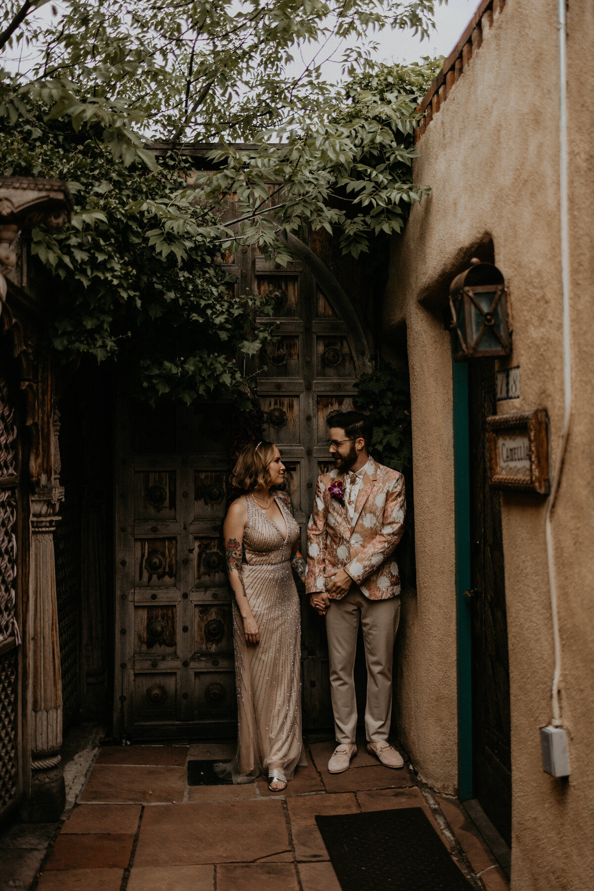 bride and groom standing together in Santa Fe before their ceremony