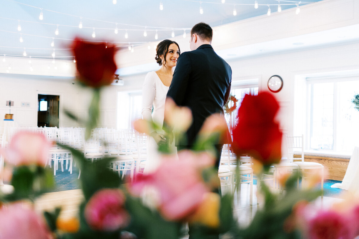 bride is looking at the groom