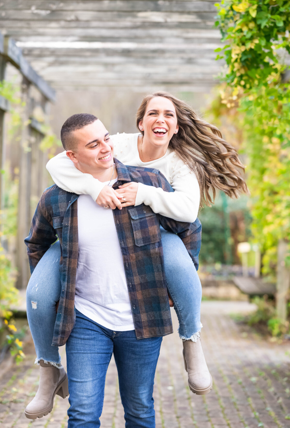 woman on man back laughing