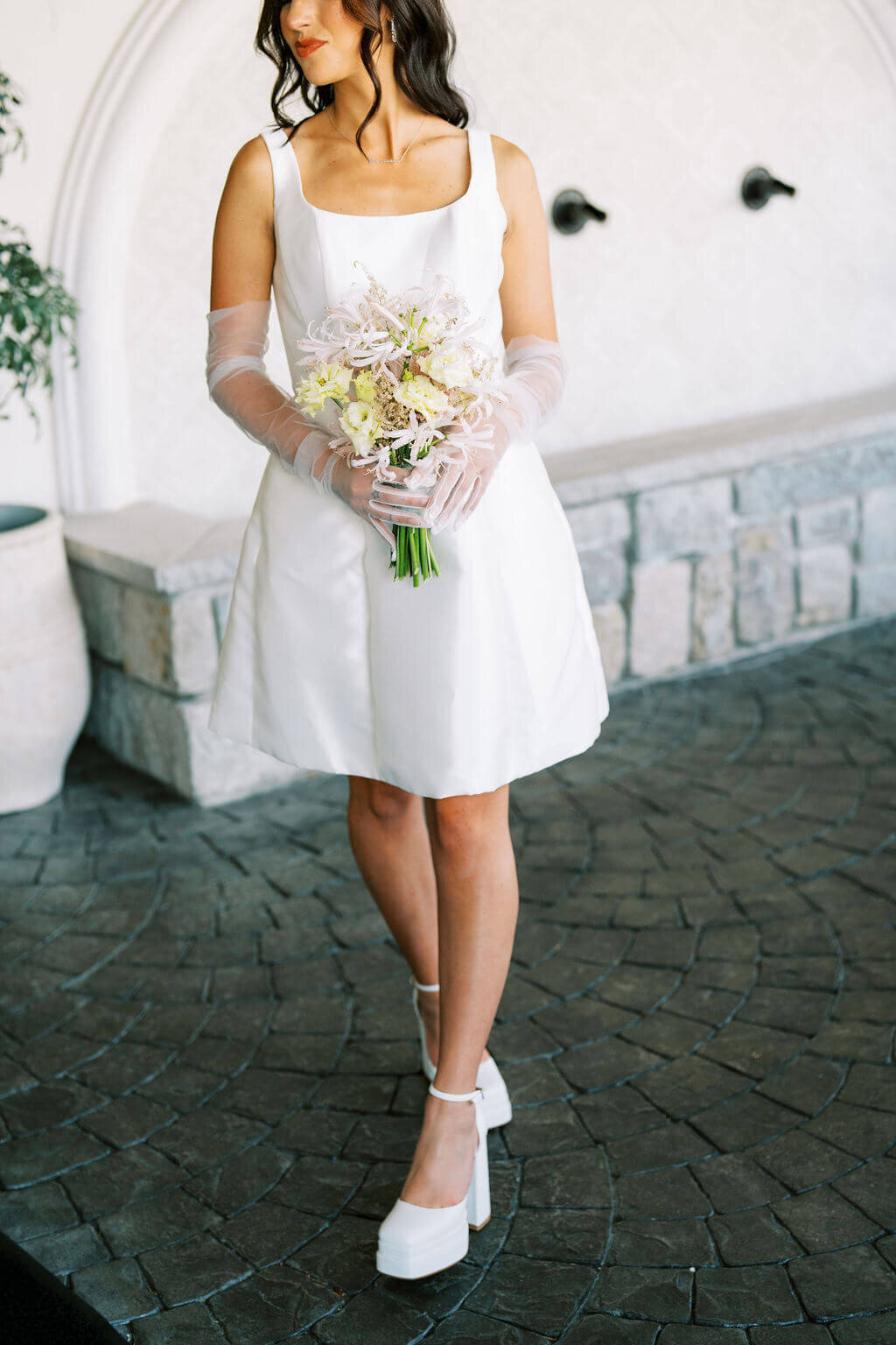 Detail of a bride in her 60's inspired wedding gown