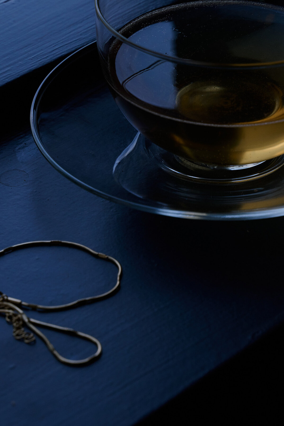 Close-Up of a teacup and jewellery on a windowsill