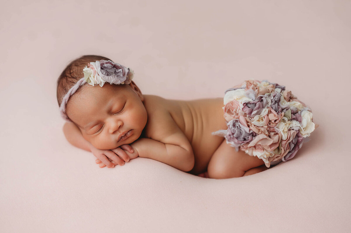 Infant posed for Newborn Portraits in Charleston.