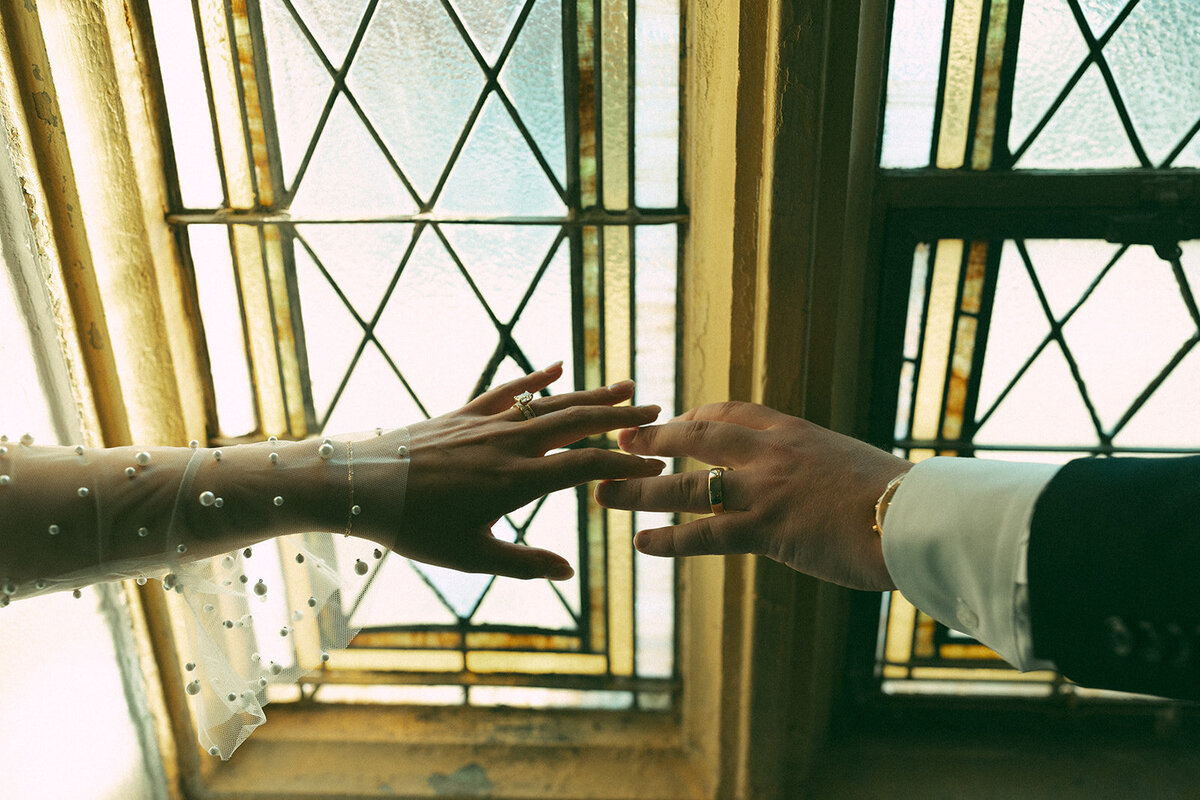 bride-reaching-out-grooms-hand-ring-kate-torline-photography
