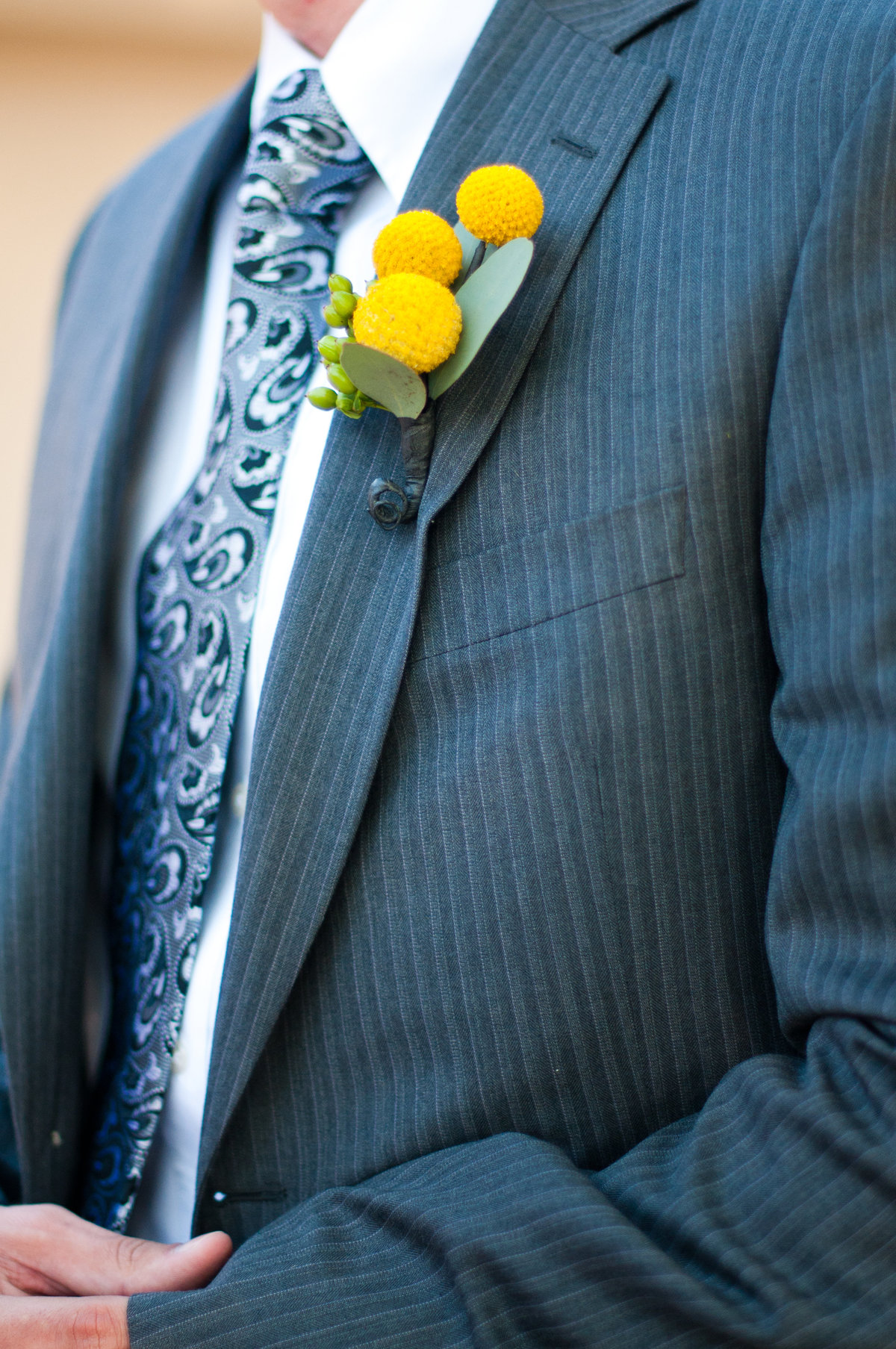 Yellow Boutonnière for the modern groom. Gray groom's attire for the backyard wedding in Los Angeles.