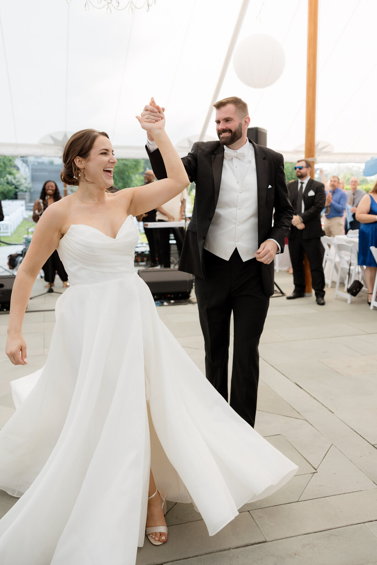 bride and groom first dance under tent at the inns of Taughannock in beautiful strapless dress  