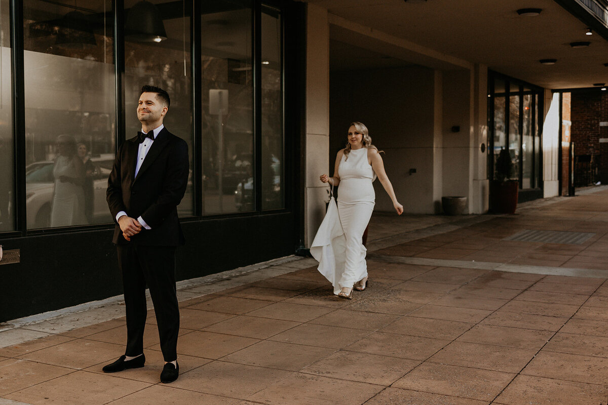 bride and groom having a first look in downtown Knoxville