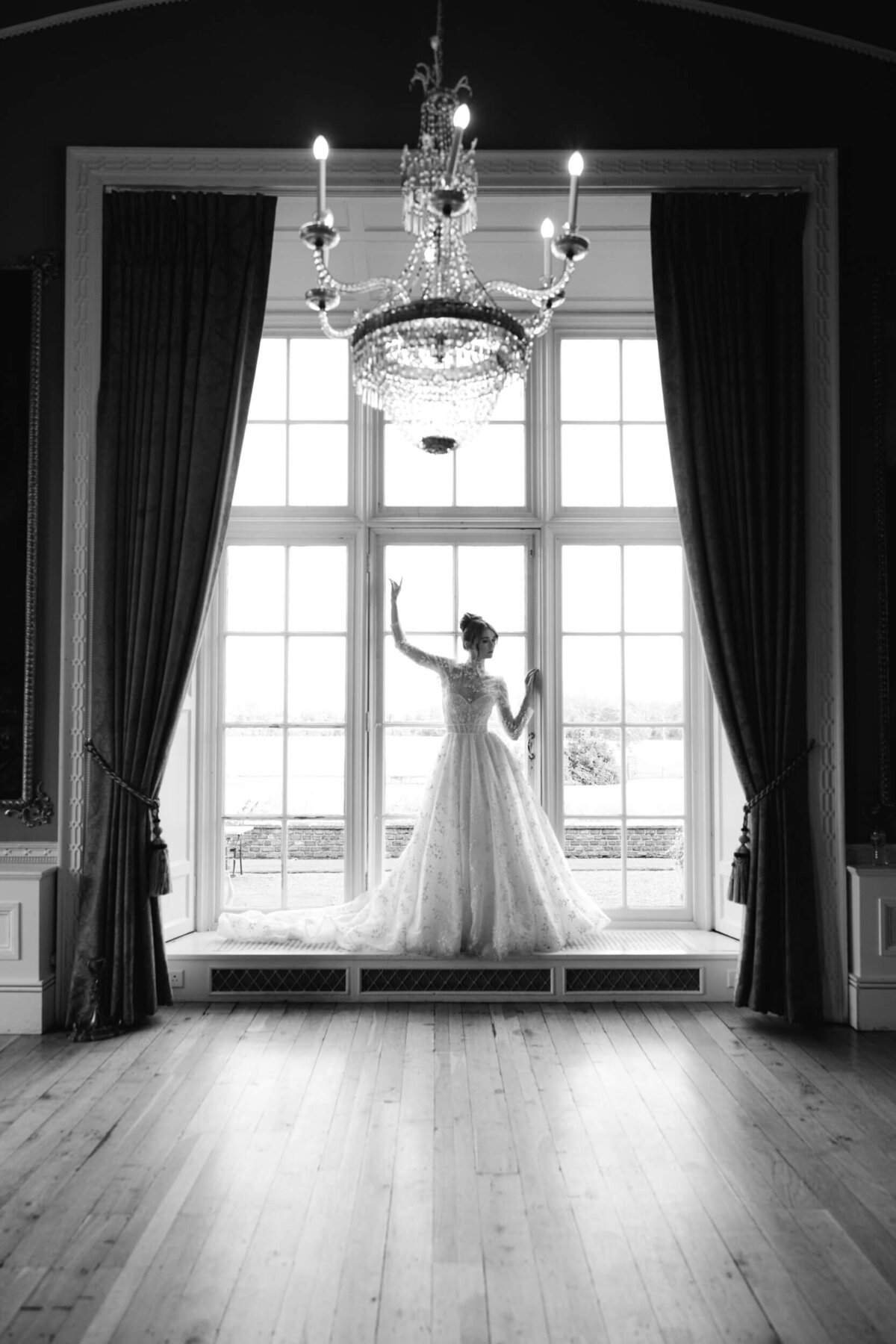 A black and white wedding day portrait of the bride in her white wedding dress at Luttrellstown Castle