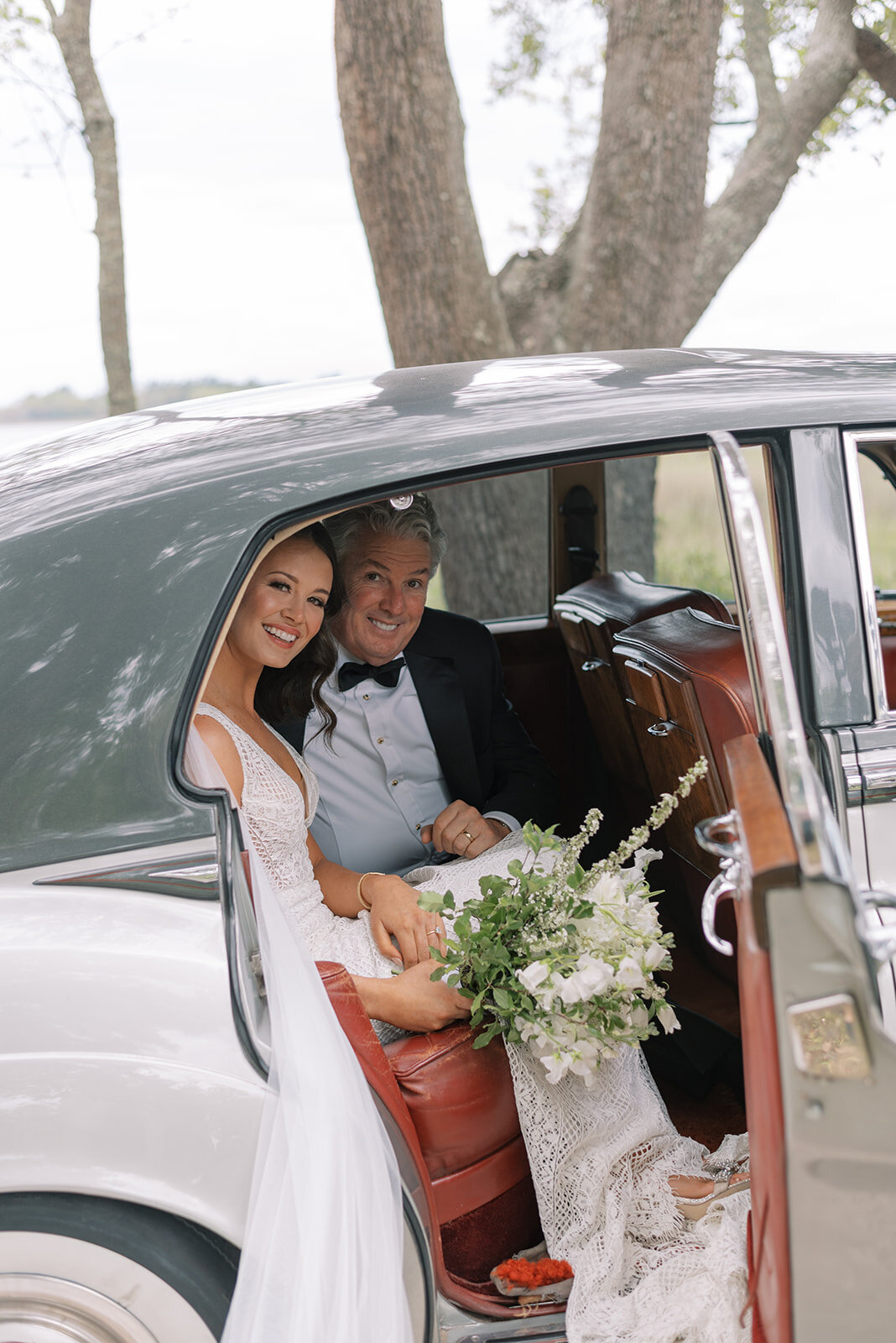 bride arrives in vintage car at wedding
