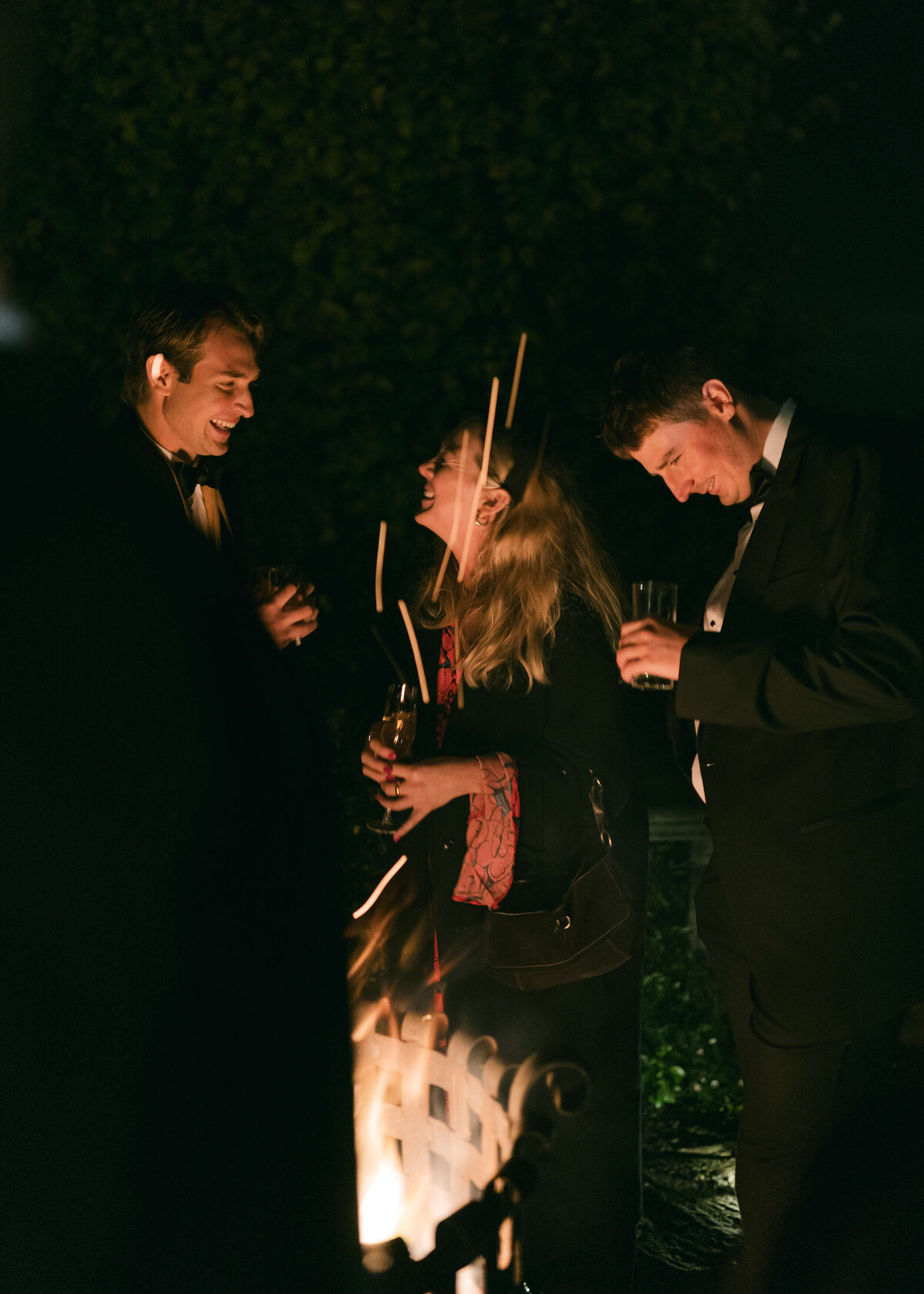 chloe-lowe-wedding-euridge-manor-cotswolds-guests-firepit