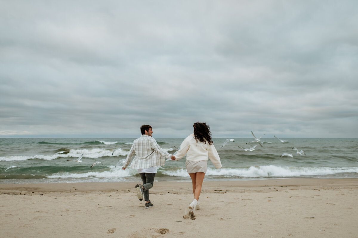 Couple walking beach South Bend session