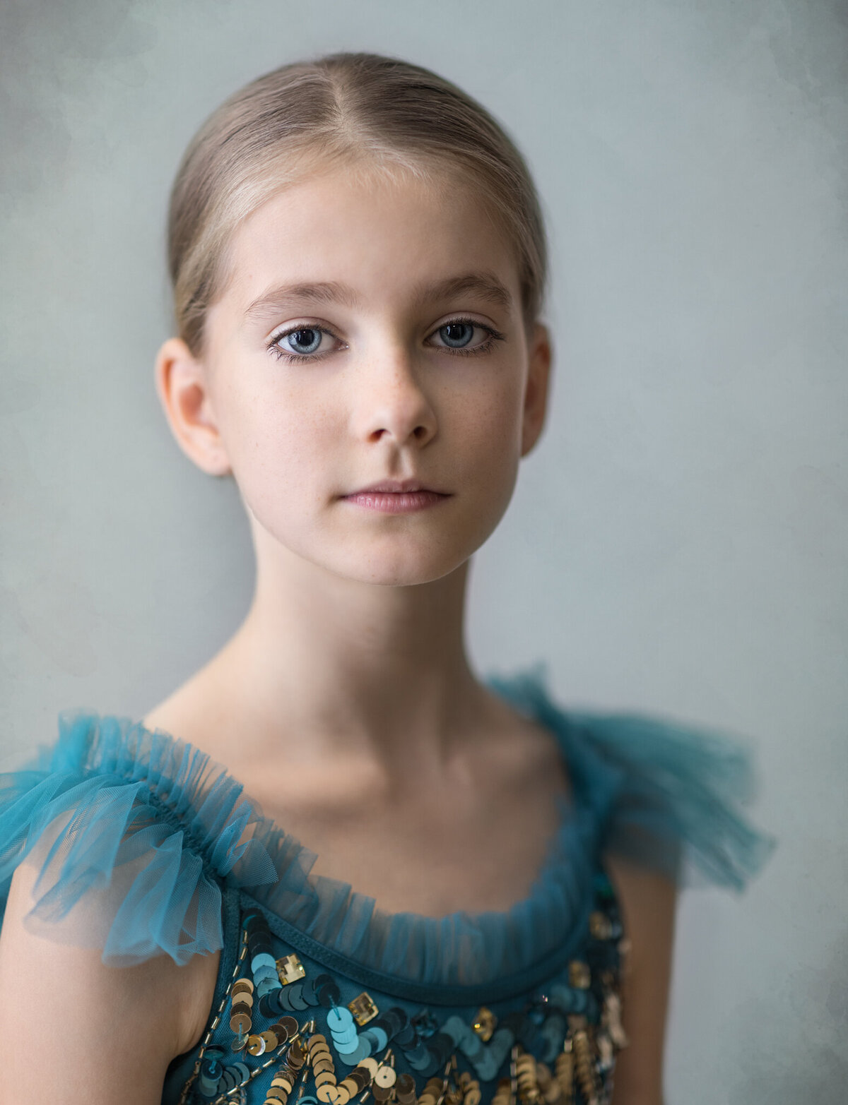 A studio headshot of ballet dancer wearing tulle dress