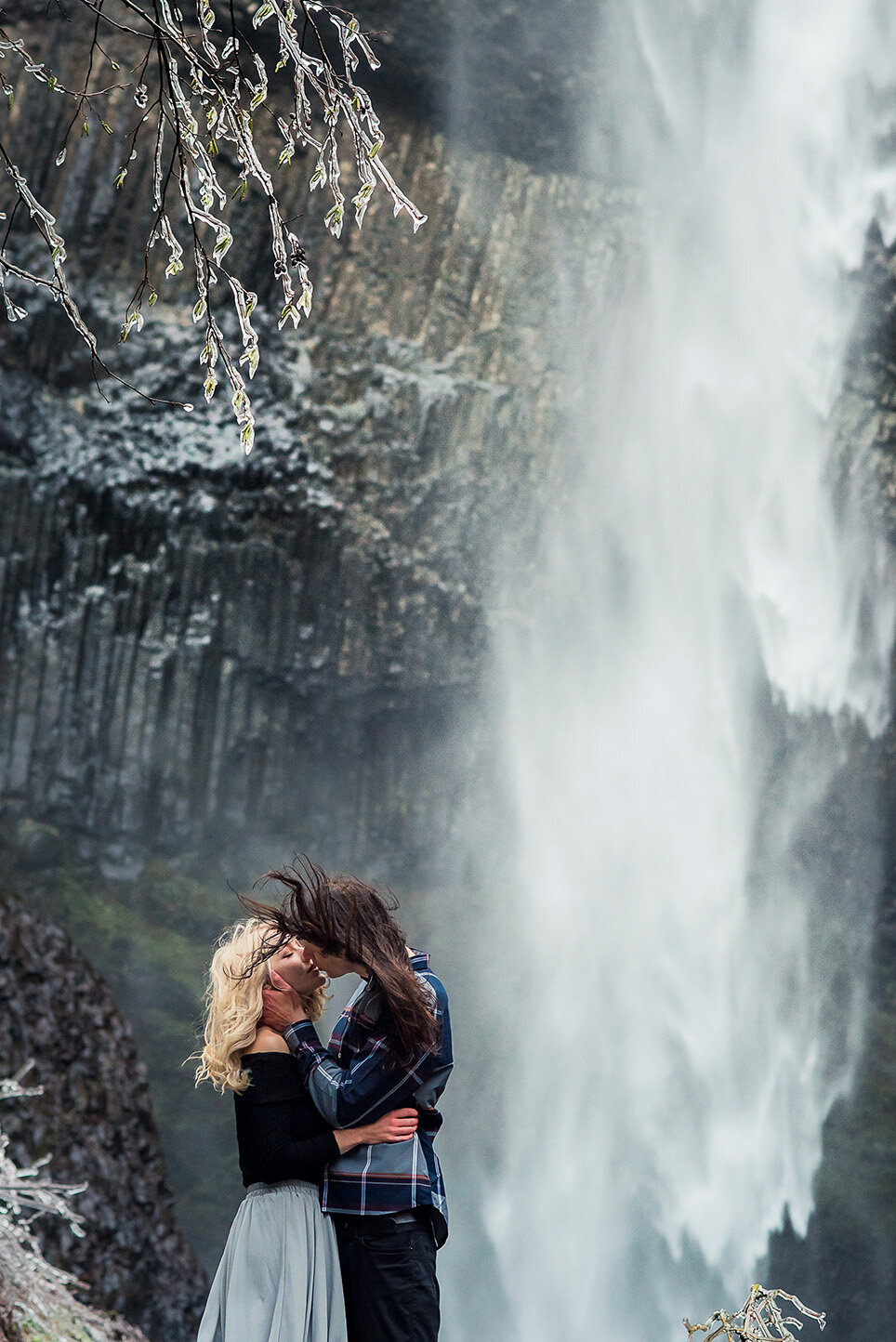 engaged couple at waterfall