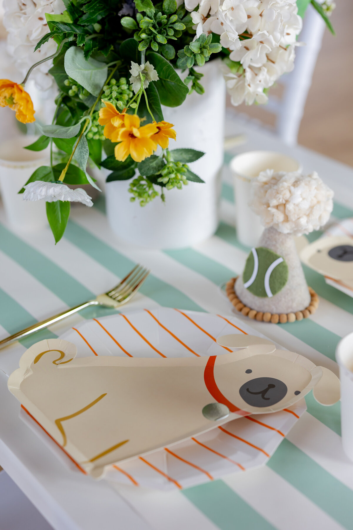 Dog party decorations on a table.