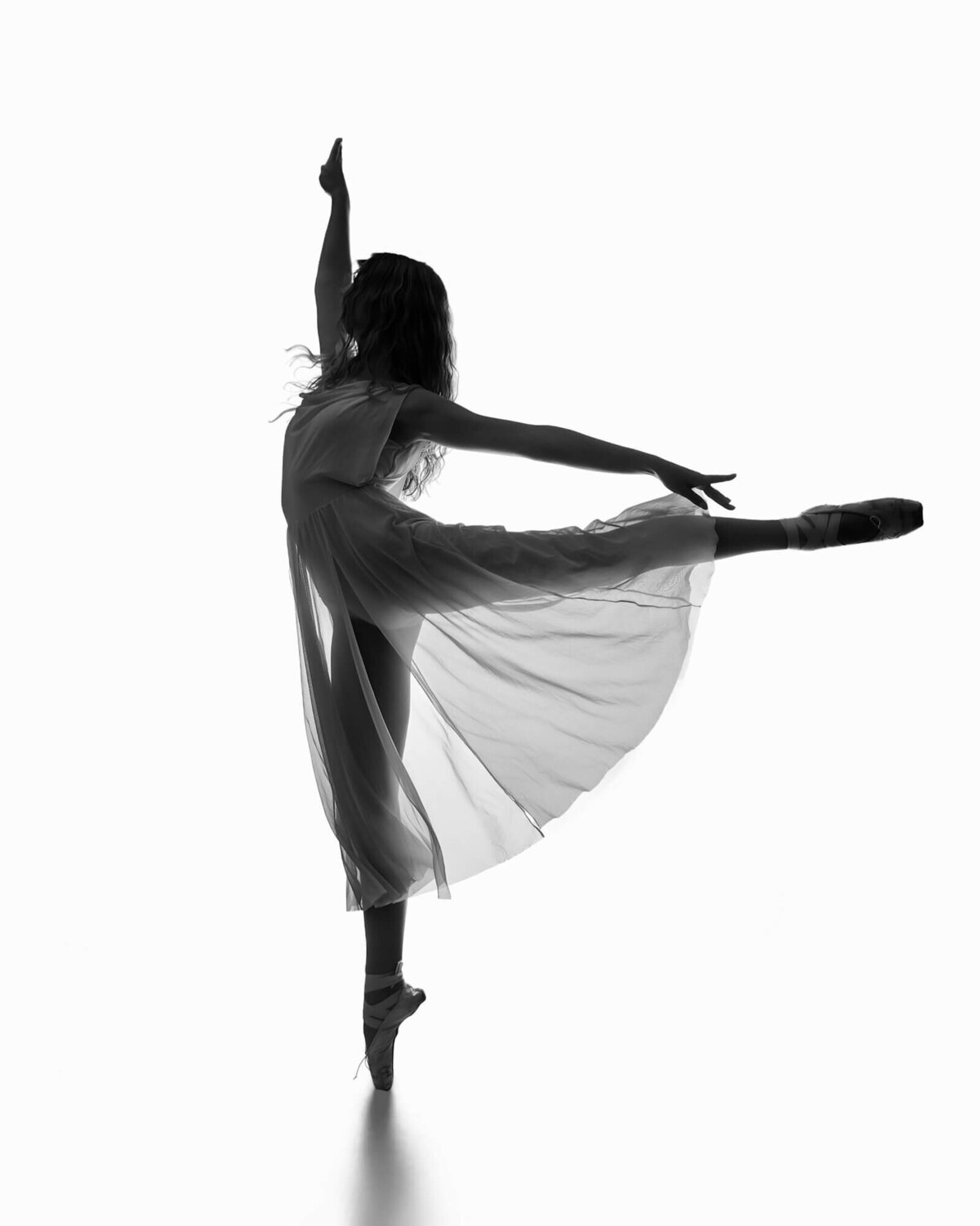 Beautiful black and white portrait of a Ballerina en pointe in an arabesque by las vegas dance photographer