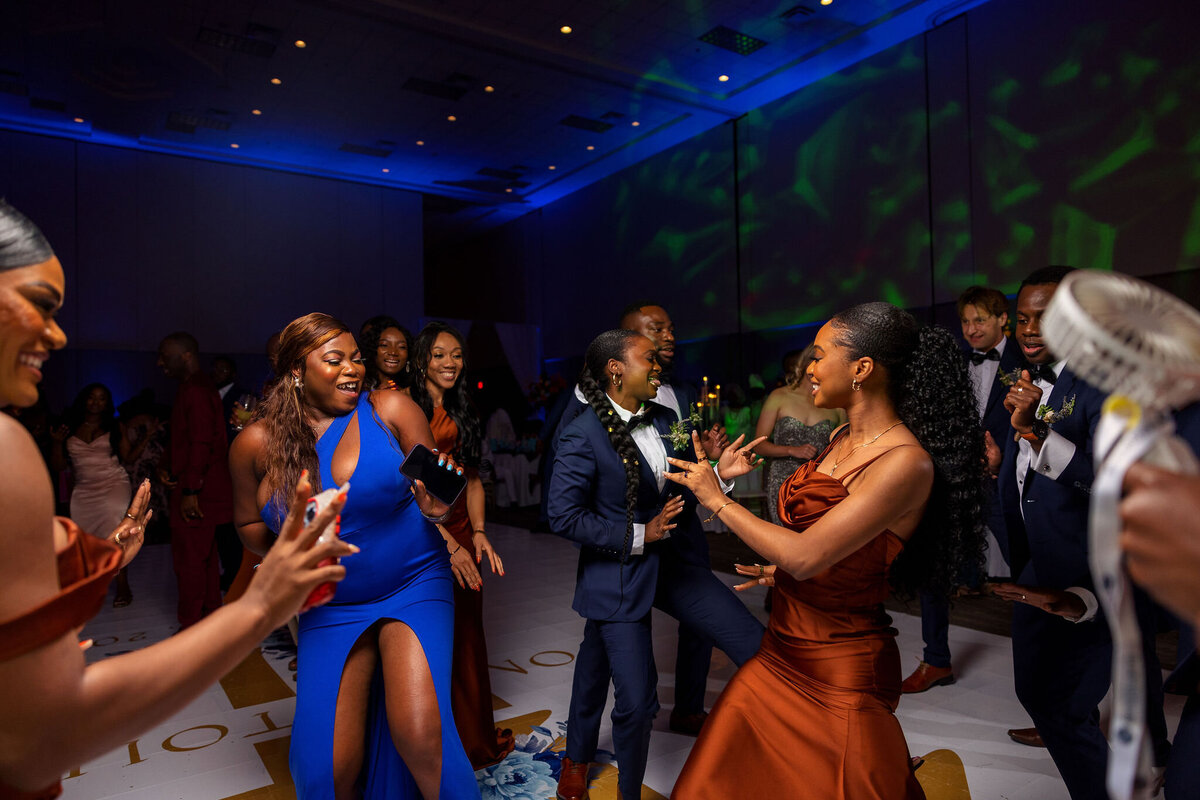 Tomi and Tolu Oruka Events Ziggy on the Lens photographer Wedding event planners Toronto planner African Nigerian Eyitayo Dada Dara Ayoola ottawa convention and event centre pocket flowers Navy blue groom suit ball gown black bride classy  259