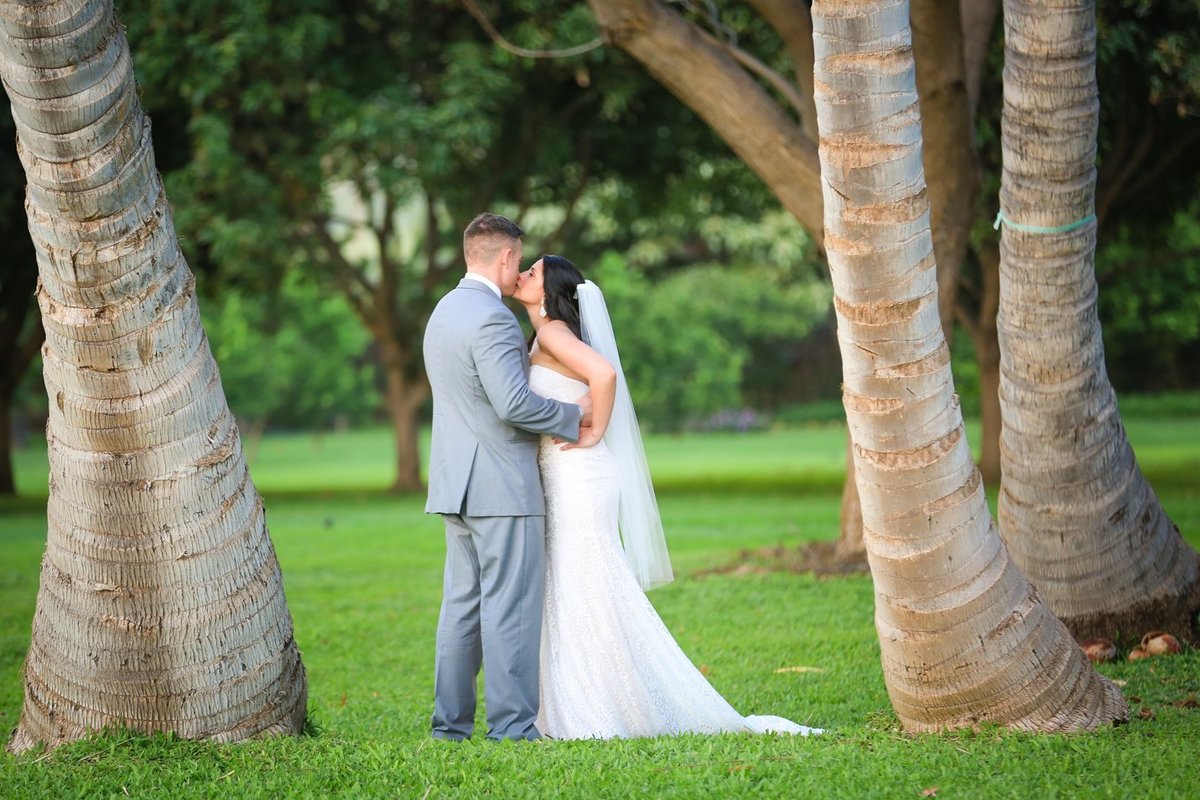 Capture Aloha Photography at The Westin Maui Resort and Spa with Wedding Kissing Scene at the coconut trees