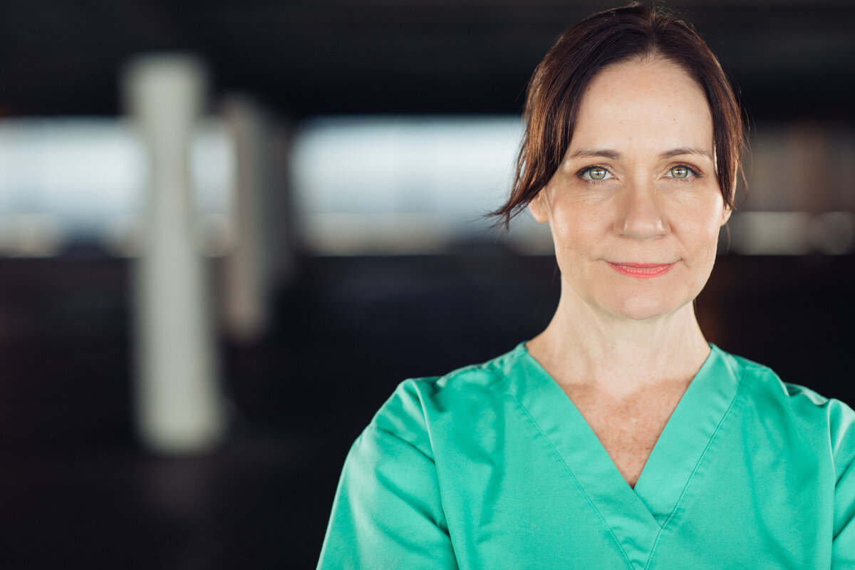 Headshot Photograph Of Woman In Mint Green Hospital Uniform Los Angeles