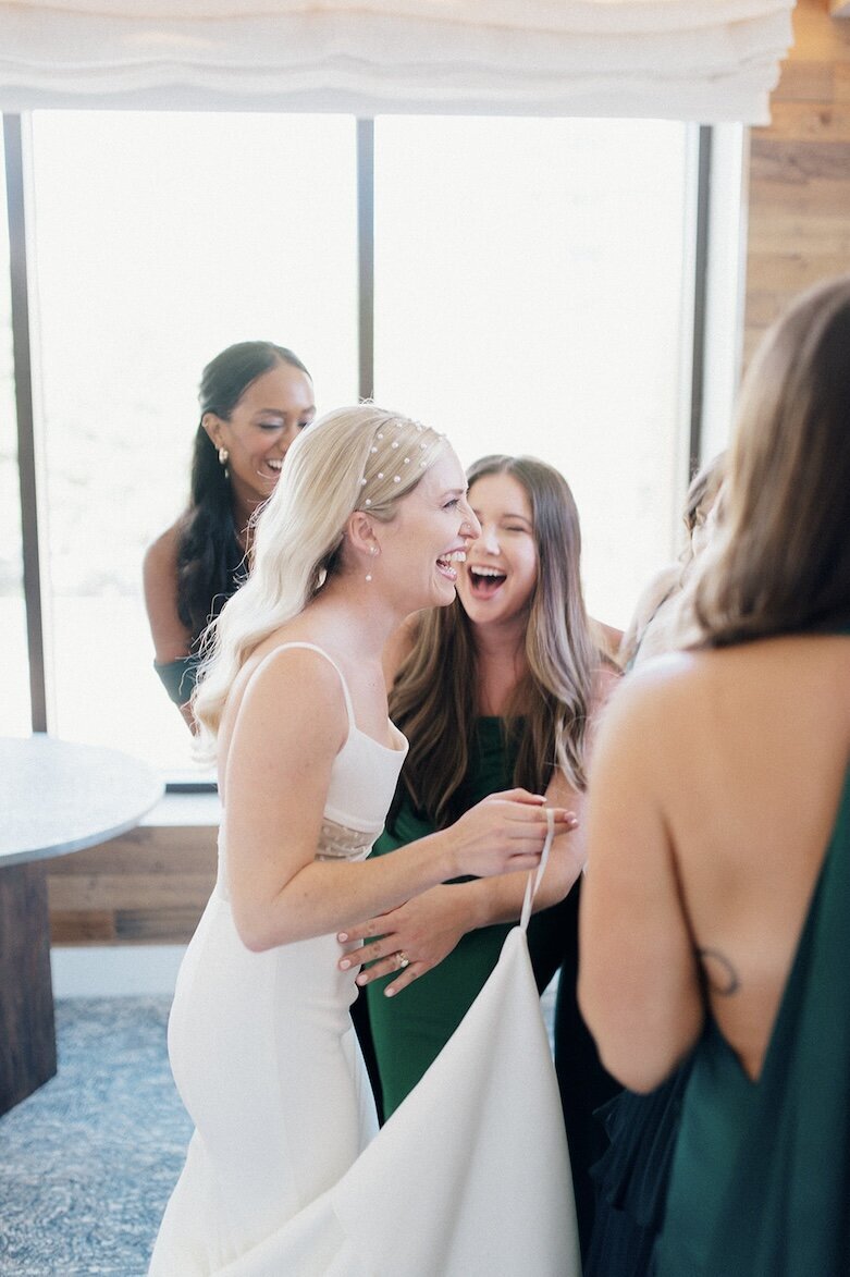 bride laughing with her friends
