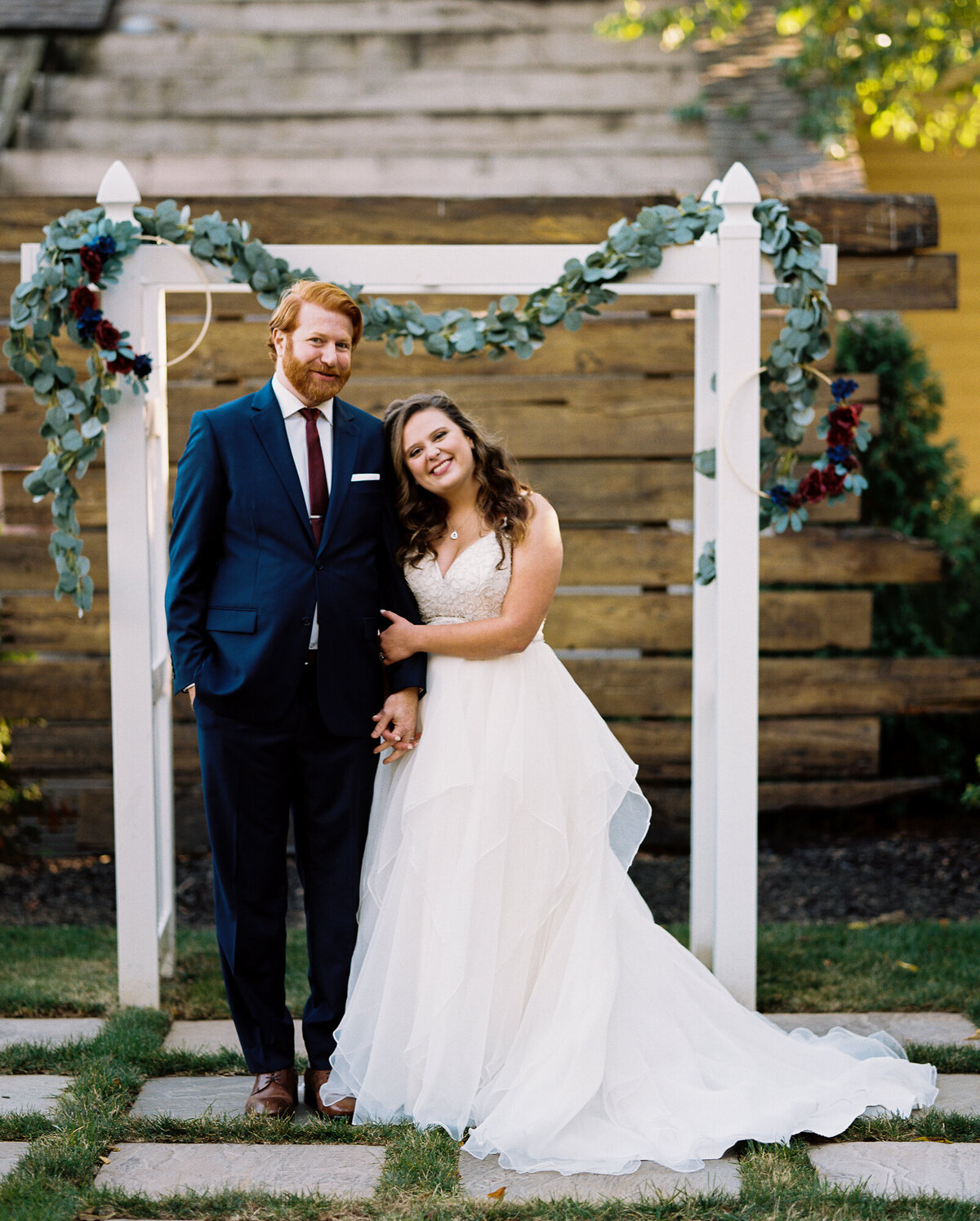 Newlyweds smile for their formal portrait after saying their vows