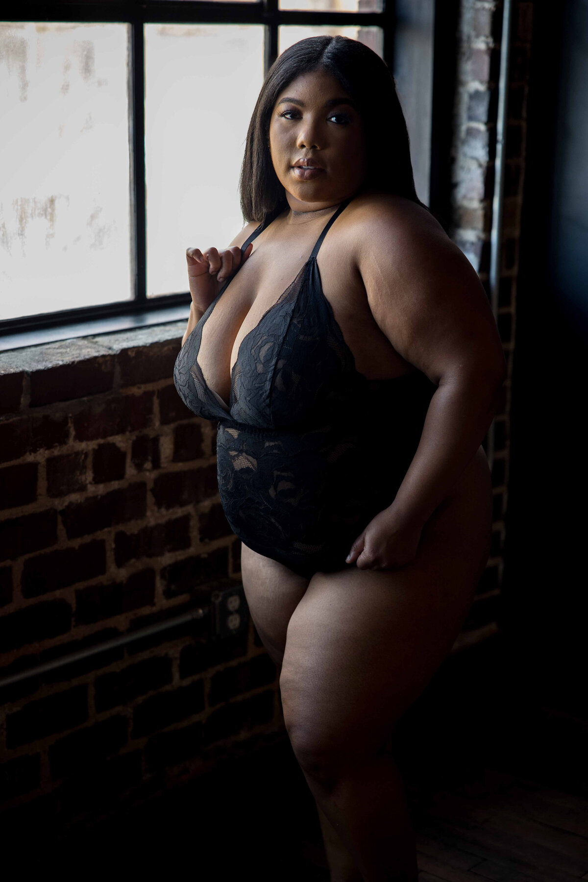 Luxury Baltimore boudoir photography portrait of woman in black lingerie by Nicole Griffin Photography
