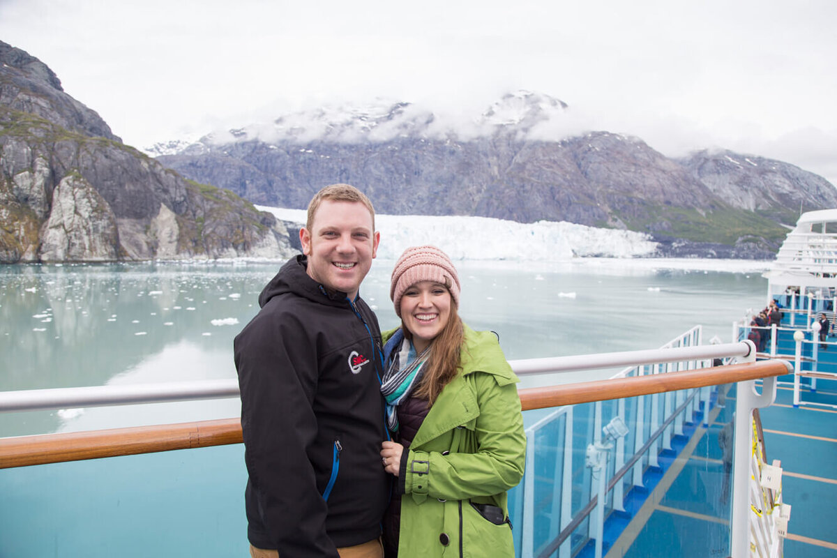 a man and woman posing on a cruise ship