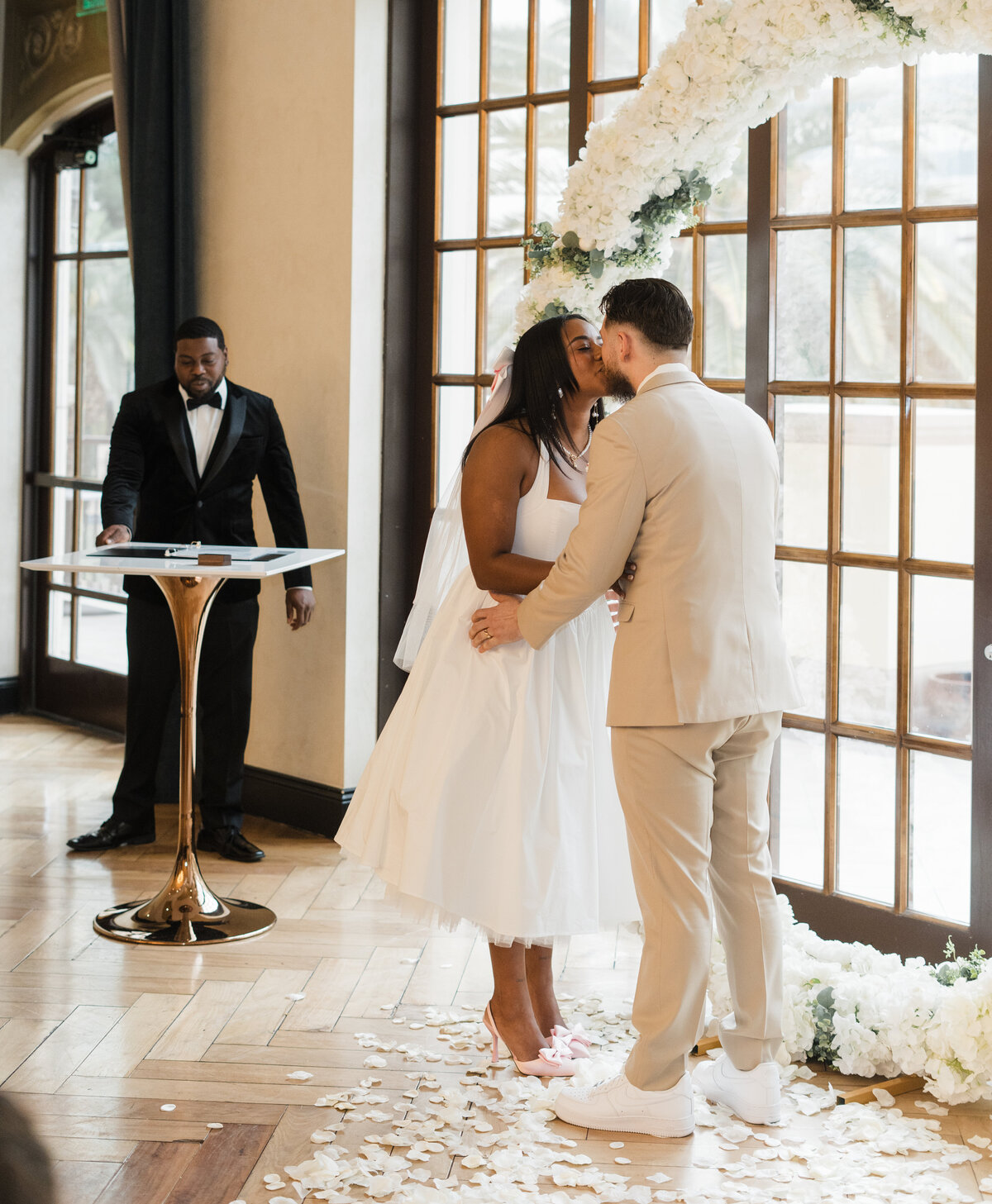 bride and groom kiss at their wedding ceremony at the stirling club in las vegas, nv