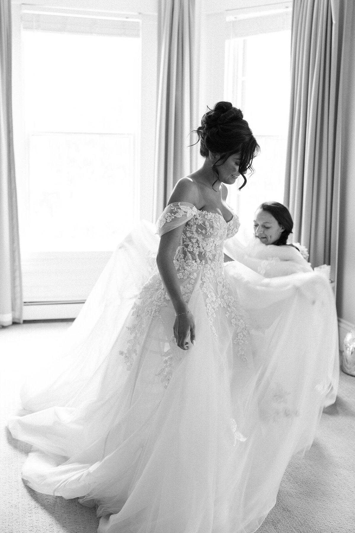 Bride gets into her wedding dress during Newport wedding.
