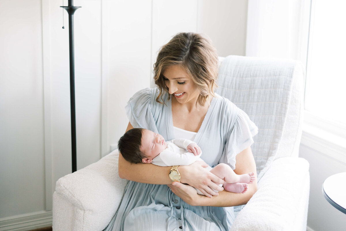 a mom holding her newborn baby