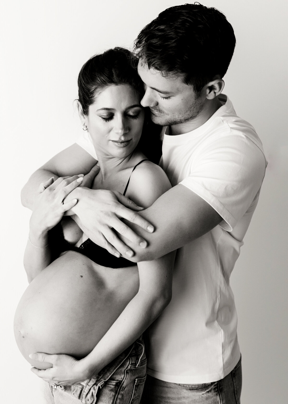 Intimate Couples Studio pregnancy photography session in Photography studio in Arvada Colorado with Denver couple
