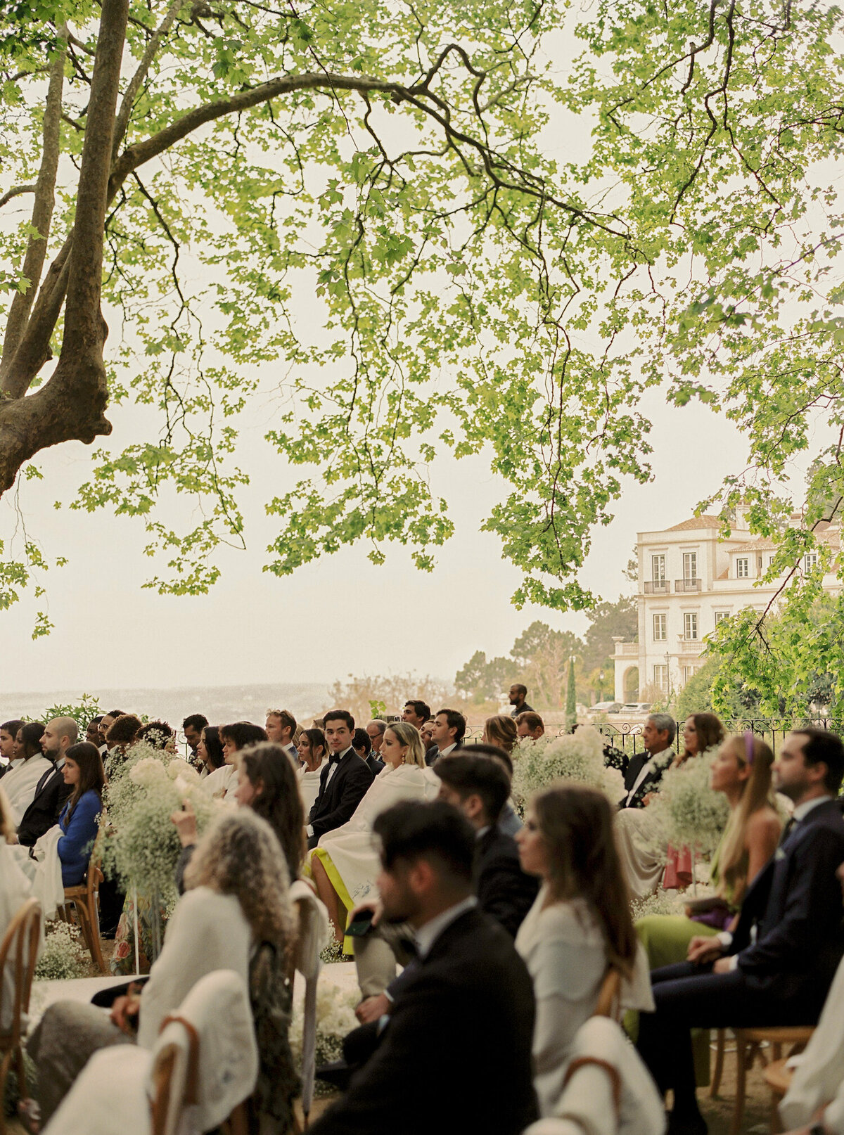Guests in the ceremony of destination wedding in Quinta da Bellavista in Sintra
