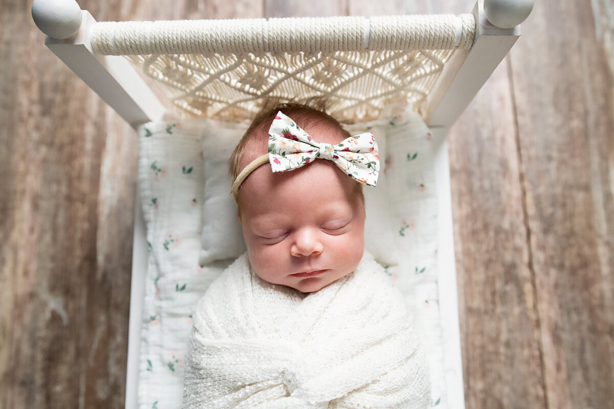 baby girl sleeping in macrame boho inspired bed