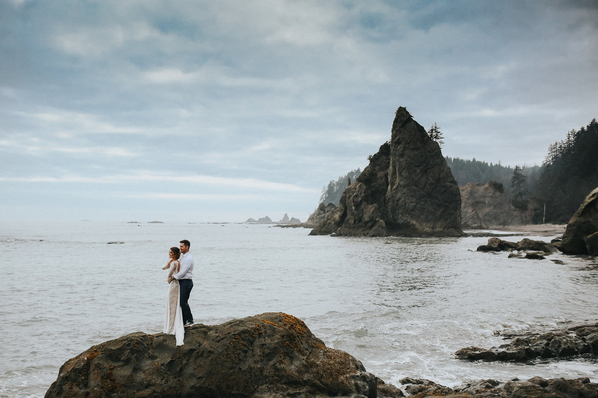 Bride and groom portrait of an elopement wedding in Forks Washington on the moody beaches of Rialto Beach.