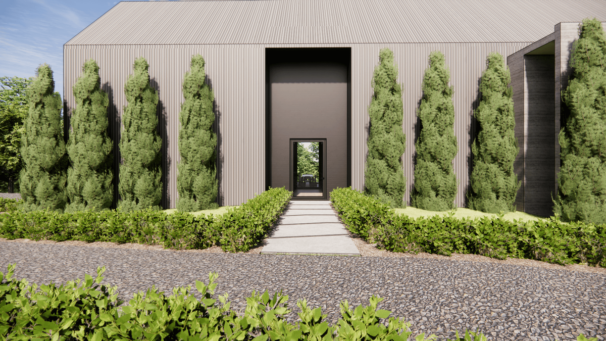 Modern building with tall, vertical siding and large entrance walkway lined with tall, narrow bushes and shrubs on either side. Pathway leads to an open doorway. Greenery surrounds the structure, under a clear blue sky.