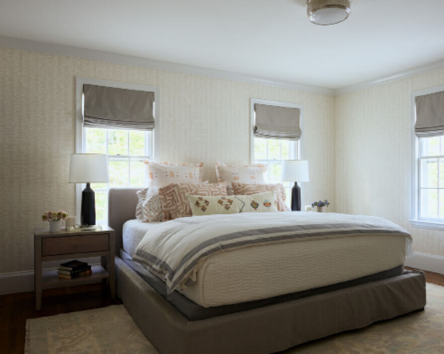 Bedroom interior design with Schumacher wallpaper, styled by interior decorators in Boston, blending bold patterns with classic furniture for a timeless look.