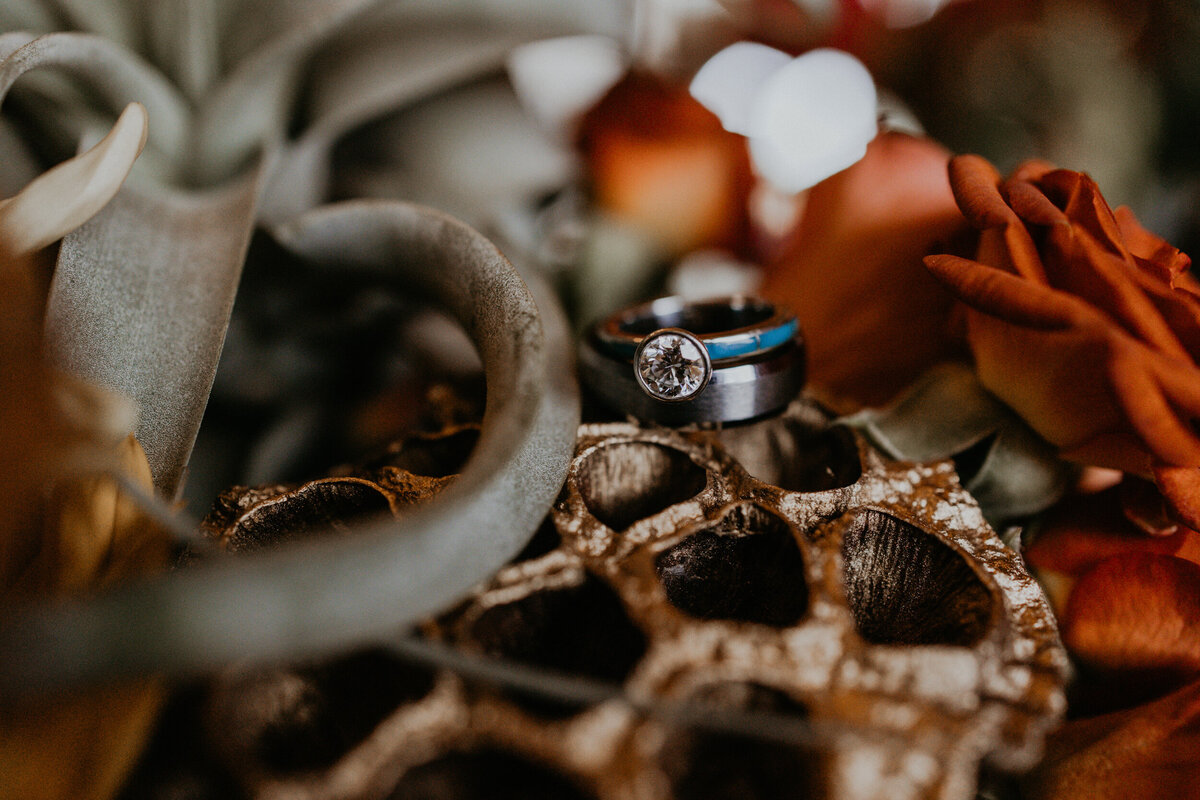 bride and grooms southwest turquoise wedding bands together